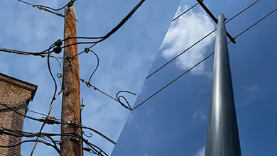 Wood and composite pole side by side